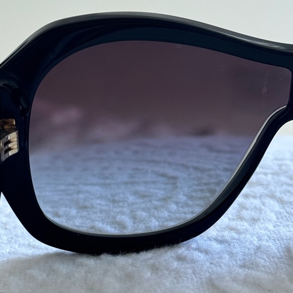 CHANEL Elegant Black Sunglasses with Silver Accent